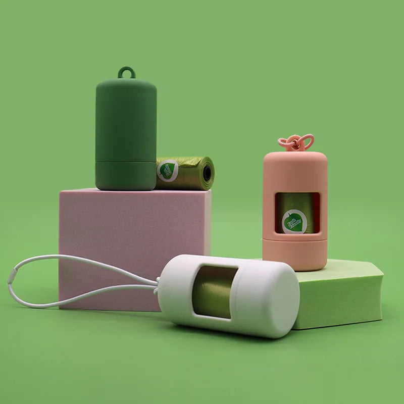 Set of small containers with a green and pink color scheme on a green background