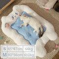 Cat lying on a blue cushion inside a cloud-shaped pet bed with size chart at the bottom.