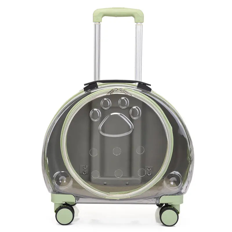 A clear plastic cat carrier suitcase with a telescoping handle, four wheels, and light green trim and handle grip, shown against a plain white background.