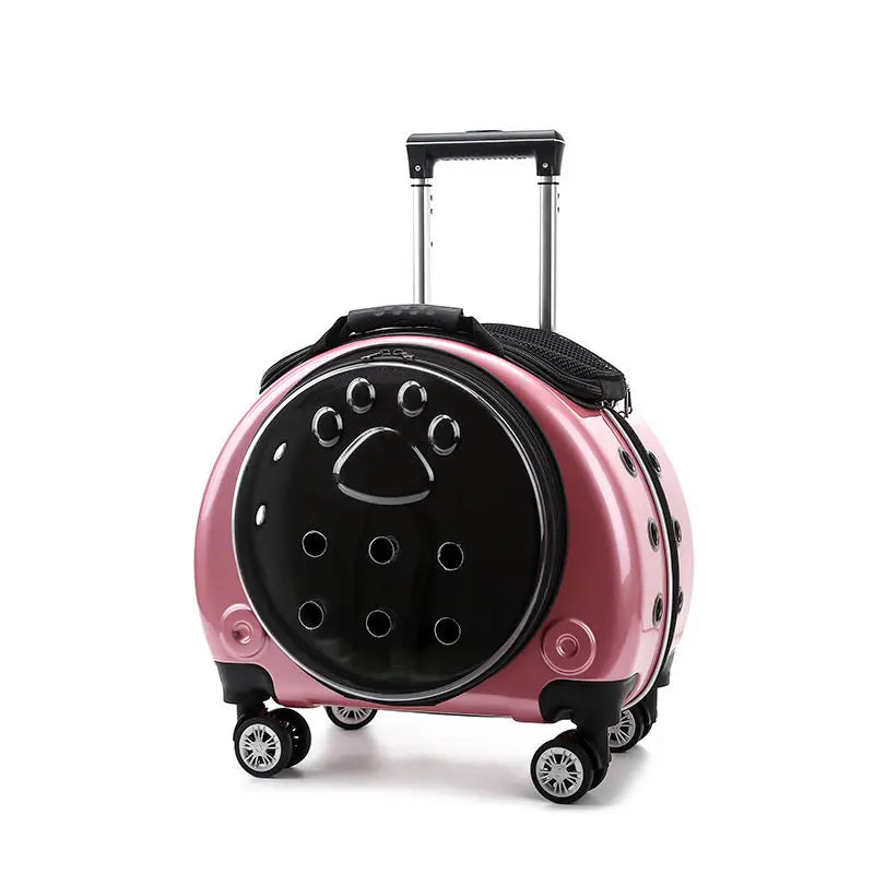 Pink and black suitcase with paw print design on a white background