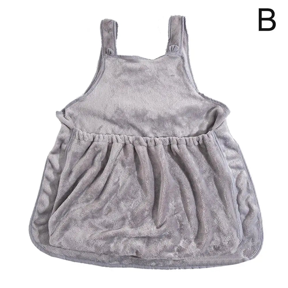 A light gray plush fleece baby romper dress with shoulder straps, shown against a plain white background with a black letter 'B' in the top right corner.