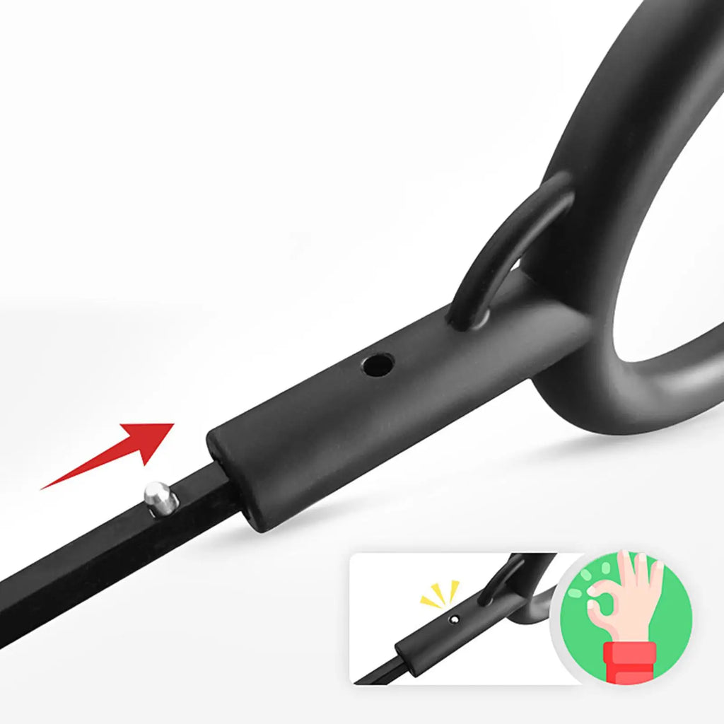 Close-up of a black exercise ring with a bar attachment, showing a red arrow pointing to a small metal pin and a small inset diagram illustrating a hand pressing a release button.
