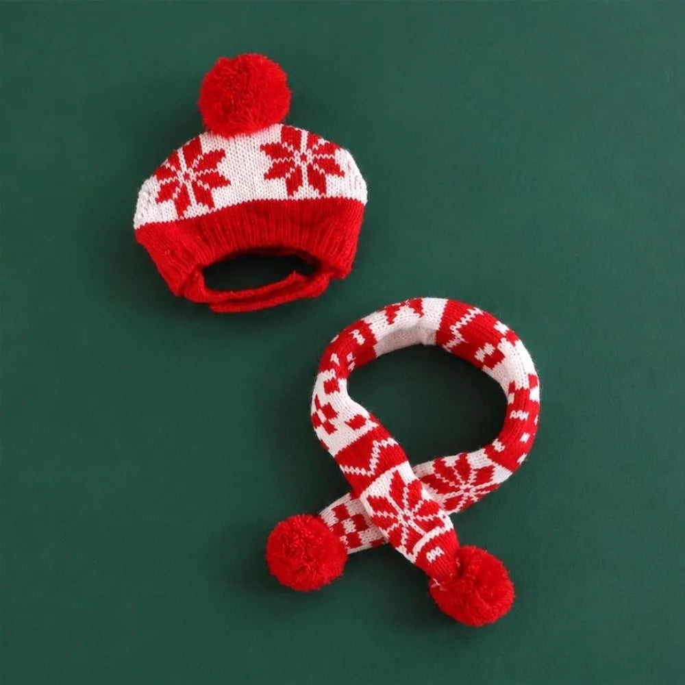 A red and white knit winter hat and matching scarf set with snowflake patterns and red pom-poms, displayed on a solid dark green background.