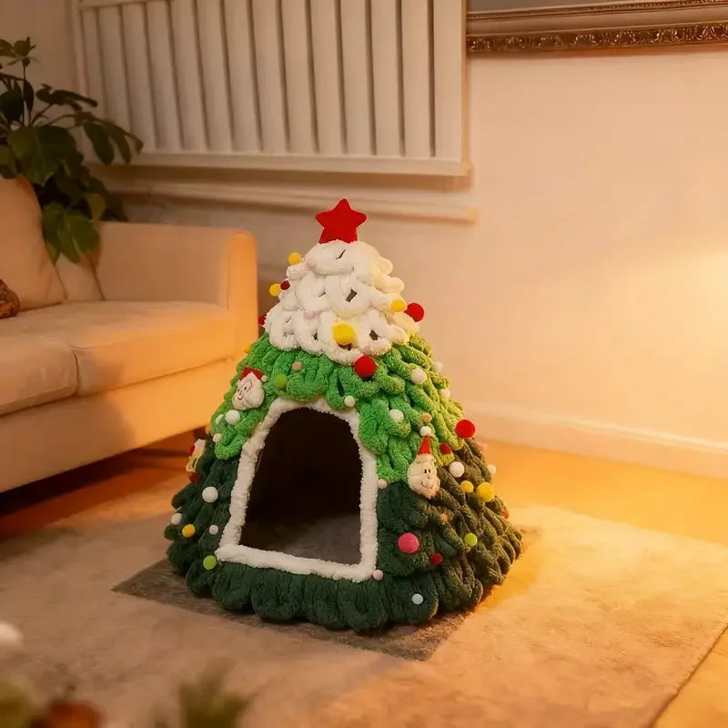 Christmas tree-shaped pet bed with lights and ornaments in a living room.