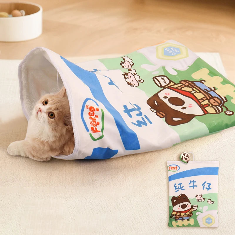 Cat playing with a milk carton toy on a wooden floor