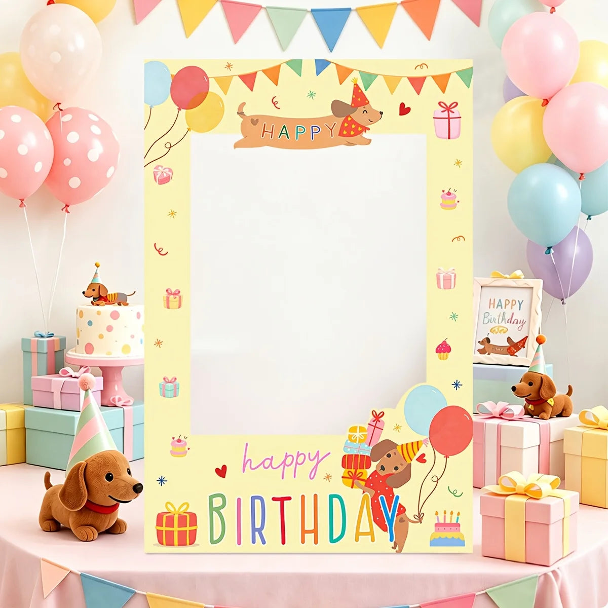 A pastel yellow birthday photo frame with cartoon dog illustrations, colorful bunting, balloons, presents, and the words 'happy birthday' displayed on a decorated party table.