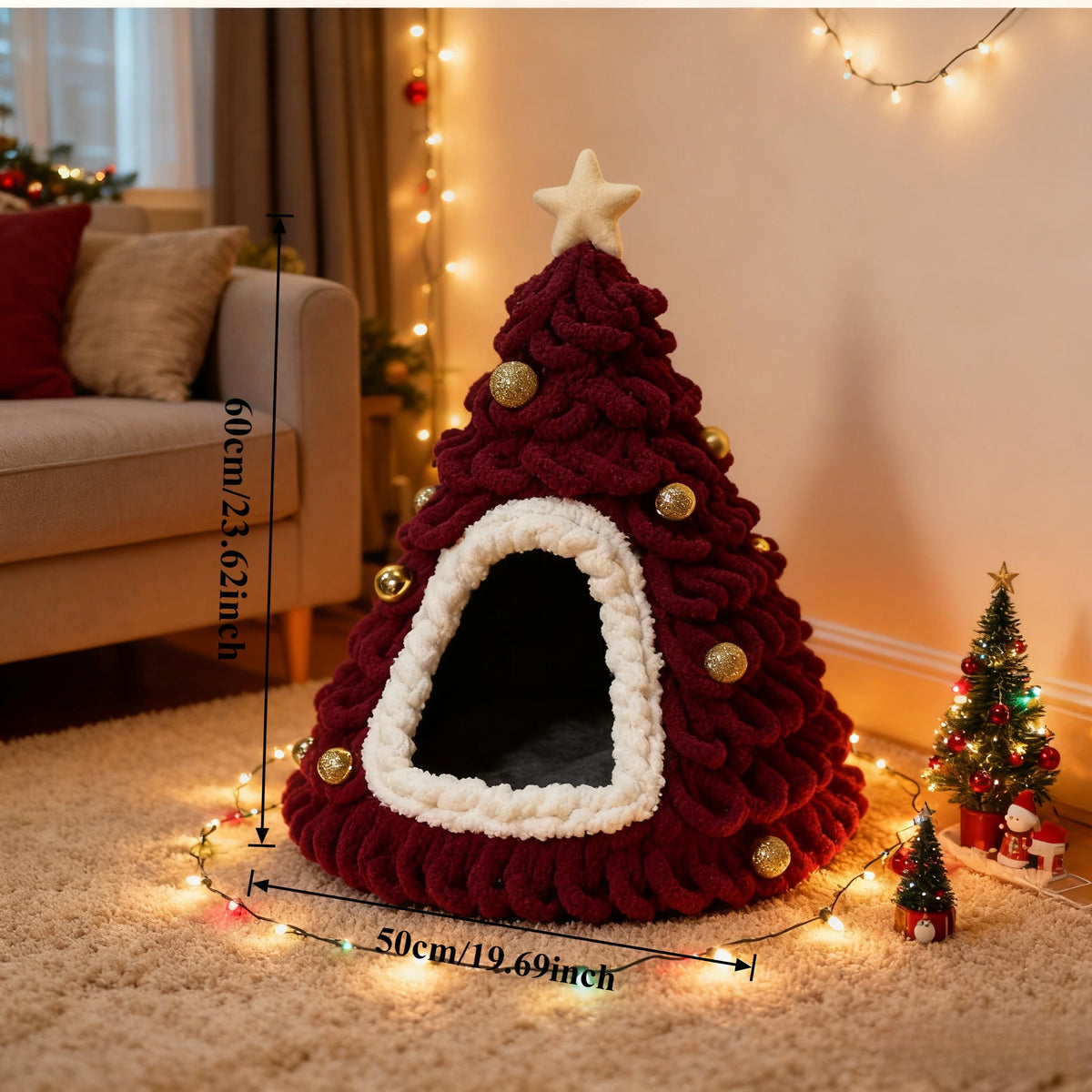 Red and white Christmas tree-shaped pet bed with measurements in a cozy living room.