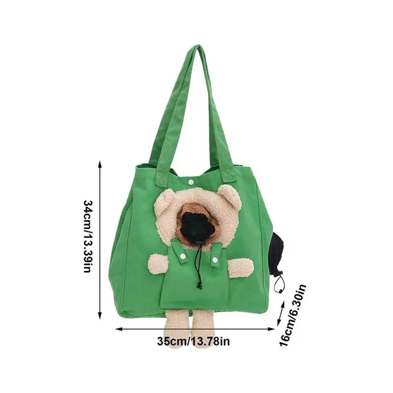 Green tote bag with a plush dog character on the front, shown with dimension lines indicating height, width, and depth measurements.