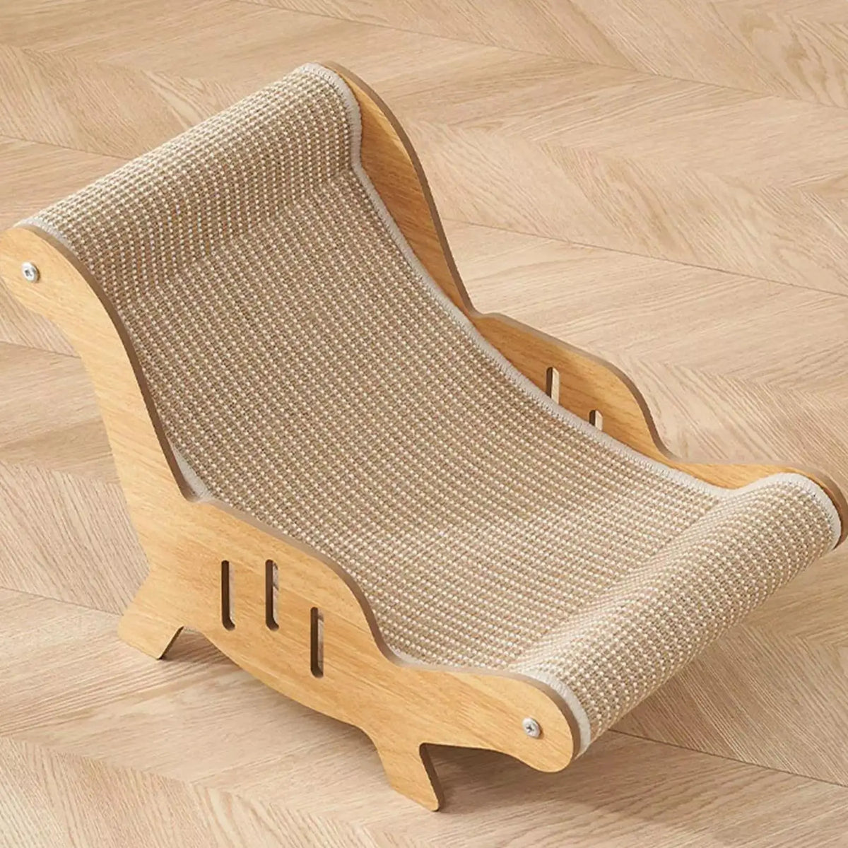 A wooden pet scratching chair with a beige woven sisal rope seat, shown on a light wood herringbone floor.