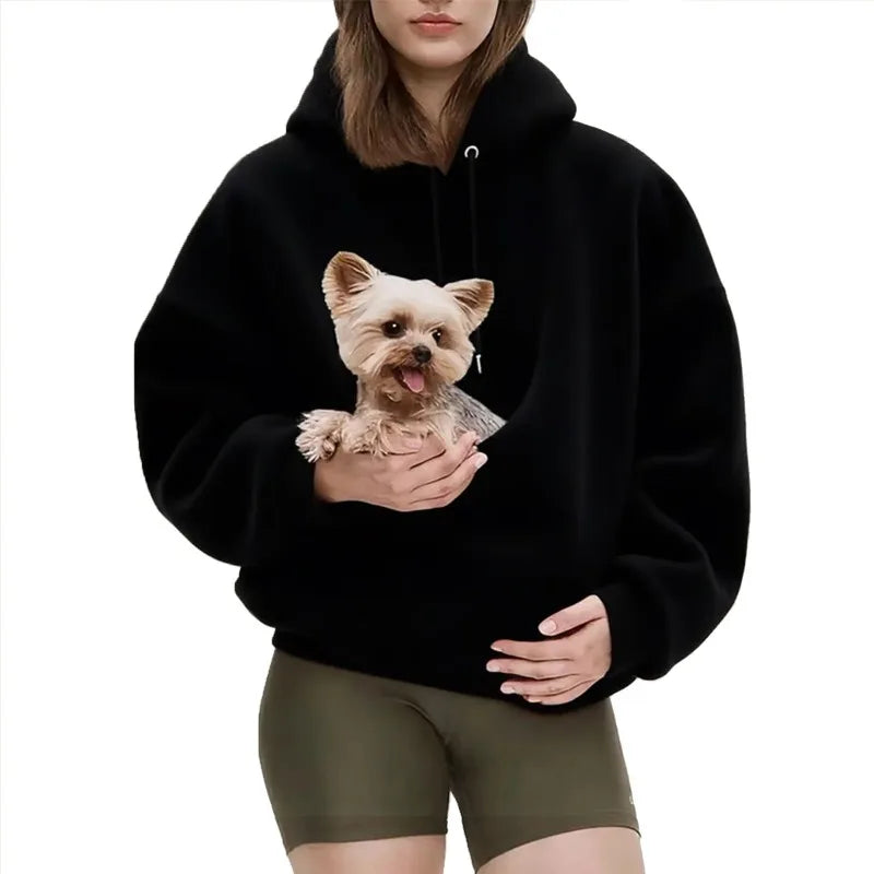 Person wearing a black hoodie with a dog graphic on a white background