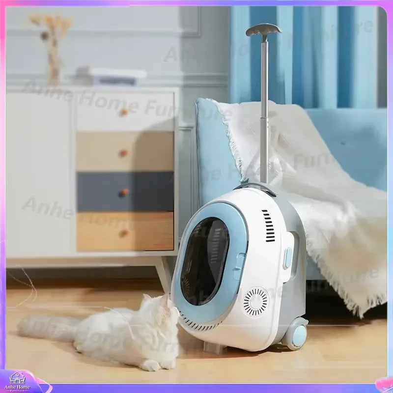 A wheeled cat litter box with an extendable handle, shown in a home setting with a white cat lying nearby. The litter box is white and light blue with gray accents.