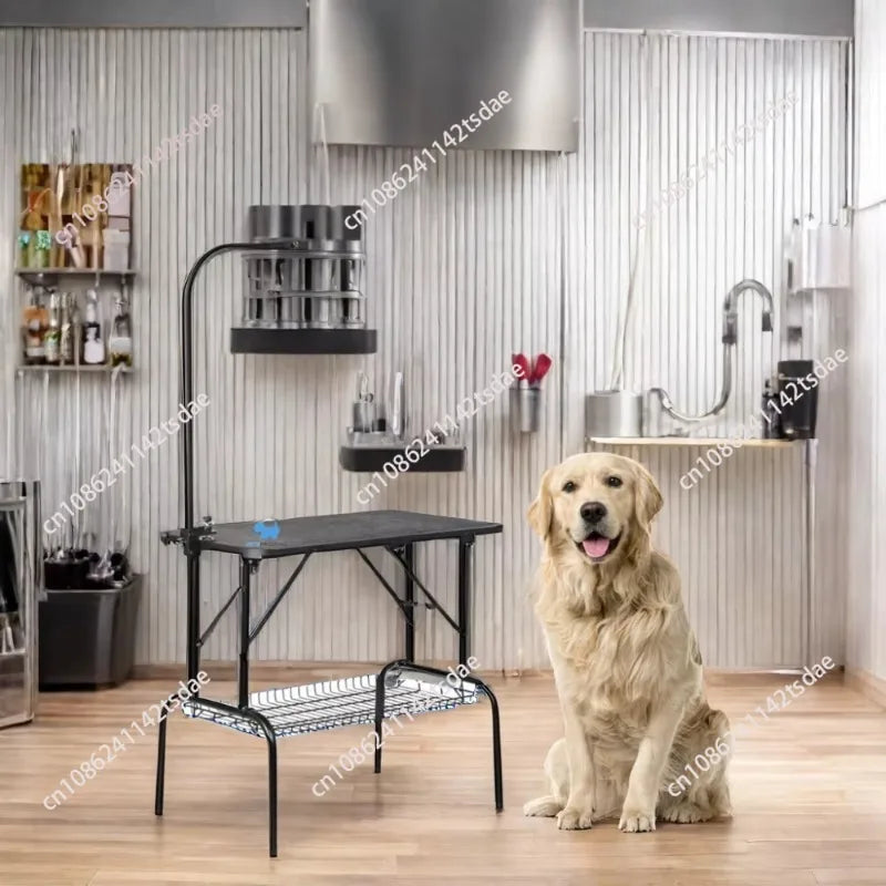 A golden retriever dog sits beside a black metal grooming table in a modern stainless steel pet grooming salon with wood floors.