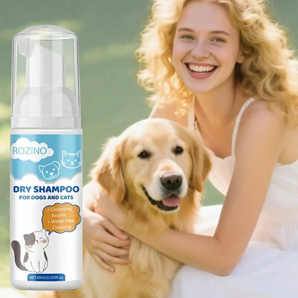 A bottle of ROZINO Dry Shampoo for dogs and cats is shown next to a smiling woman hugging a golden retriever dog, set against a soft green outdoor background.