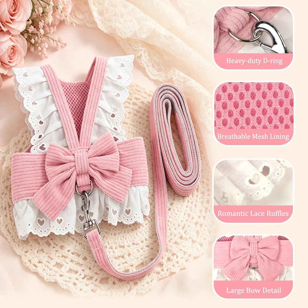 Pink and white pet harness with matching leash laid out on a lace mat, with three inset detail callouts showing a heavy-duty D-ring, breathable mesh lining, and the large bow detail.