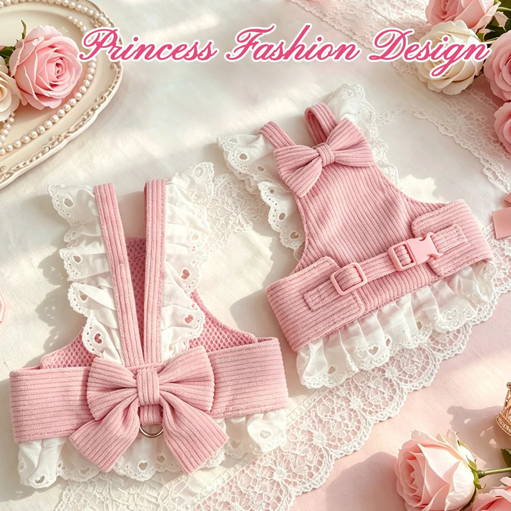 Two pink ribbed pet harnesses with white lace ruffles and large bows, arranged on a soft pink surface with lace and roses. Pink script text at the top reads 'Princess Fashion Design'.