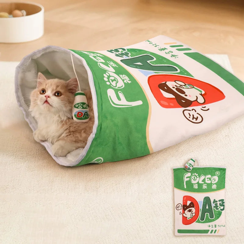 Cat inside a green and white package with Fuloen branding on a wooden floor.