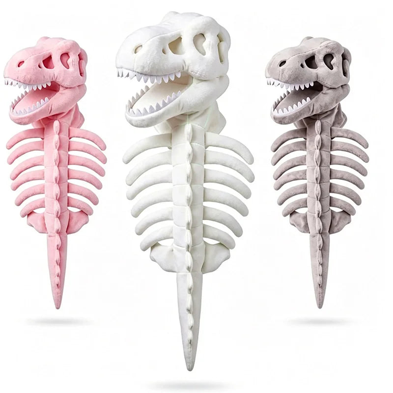 Three plush dinosaur skeleton toys in pink, off-white, and light gray, arranged side by side against a plain white background.
