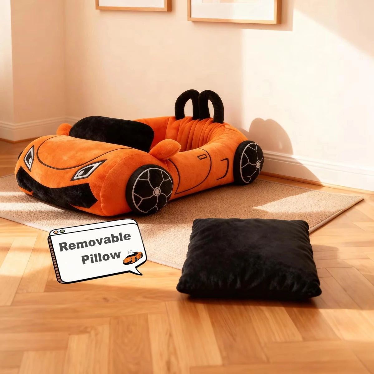 Orange car-shaped pet bed with a black pillow on a wooden floor.