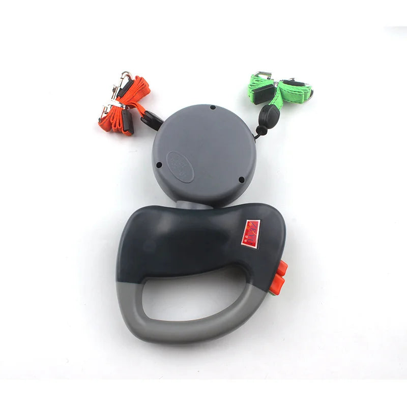 Retractable dog leash with handle and attachments on a white background