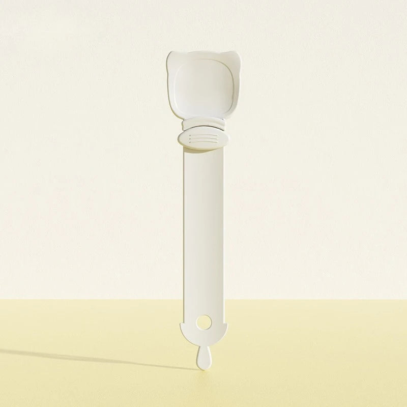 White plastic clip on a light beige background