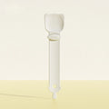 White plastic clip on a light beige background