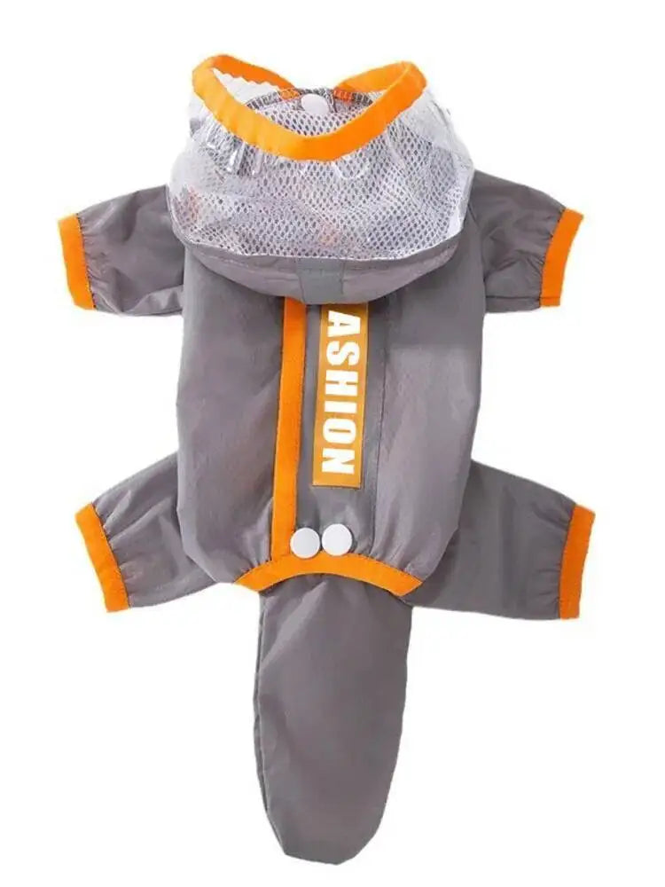 A gray dog raincoat with orange trim, featuring a hood with a mesh window, elbow and ankle cuffs, and a vertical front zipper with the word 'ASHION' printed on it.
