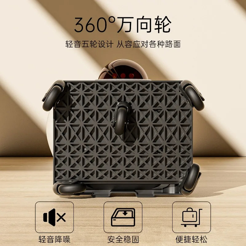 Black suitcase with geometric pattern and 360-degree wheel design on a wooden surface.