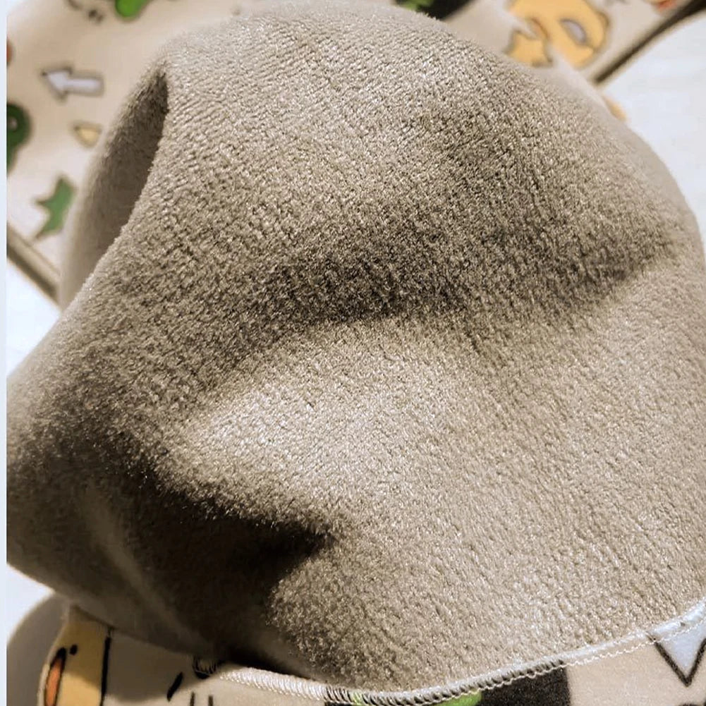 Close-up of a textured beige hat with a patterned background