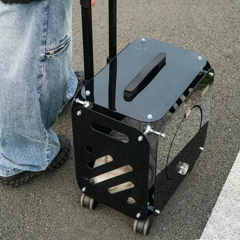 Black metal stool with wheels on a concrete surface