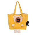 A yellow canvas tote bag featuring a plush dog character attached to the front, with cream-colored ears and paws, a brown face patch, and a small black plush tail on the side.