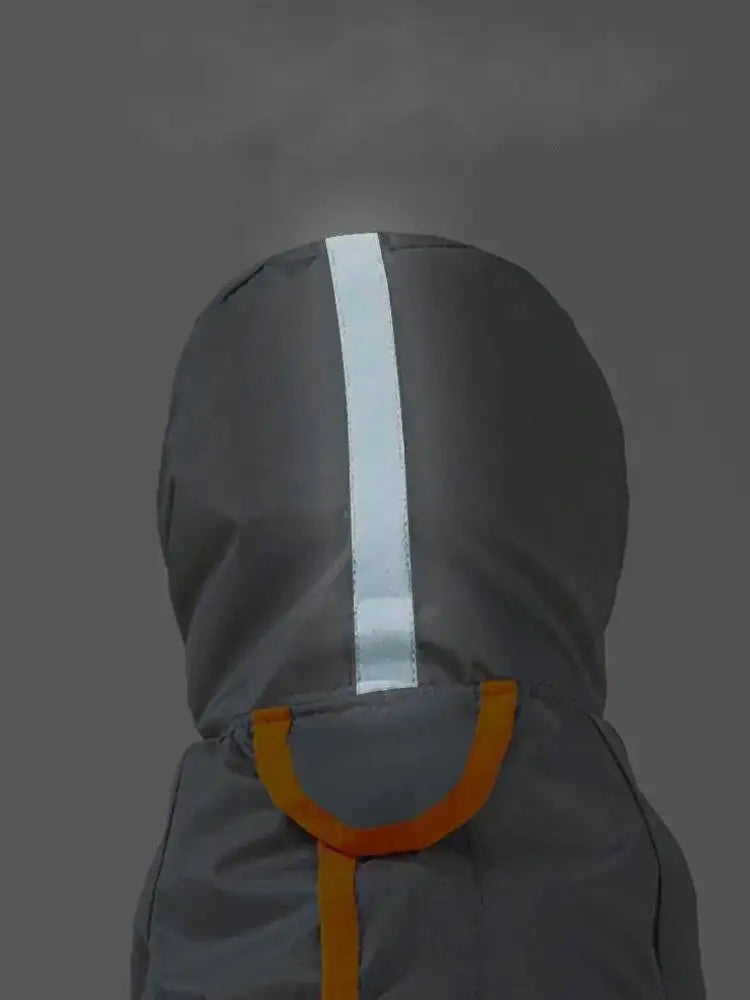 A close-up of a gray hooded garment or protective cover with a vertical reflective white stripe down the center and orange trim details near the bottom.